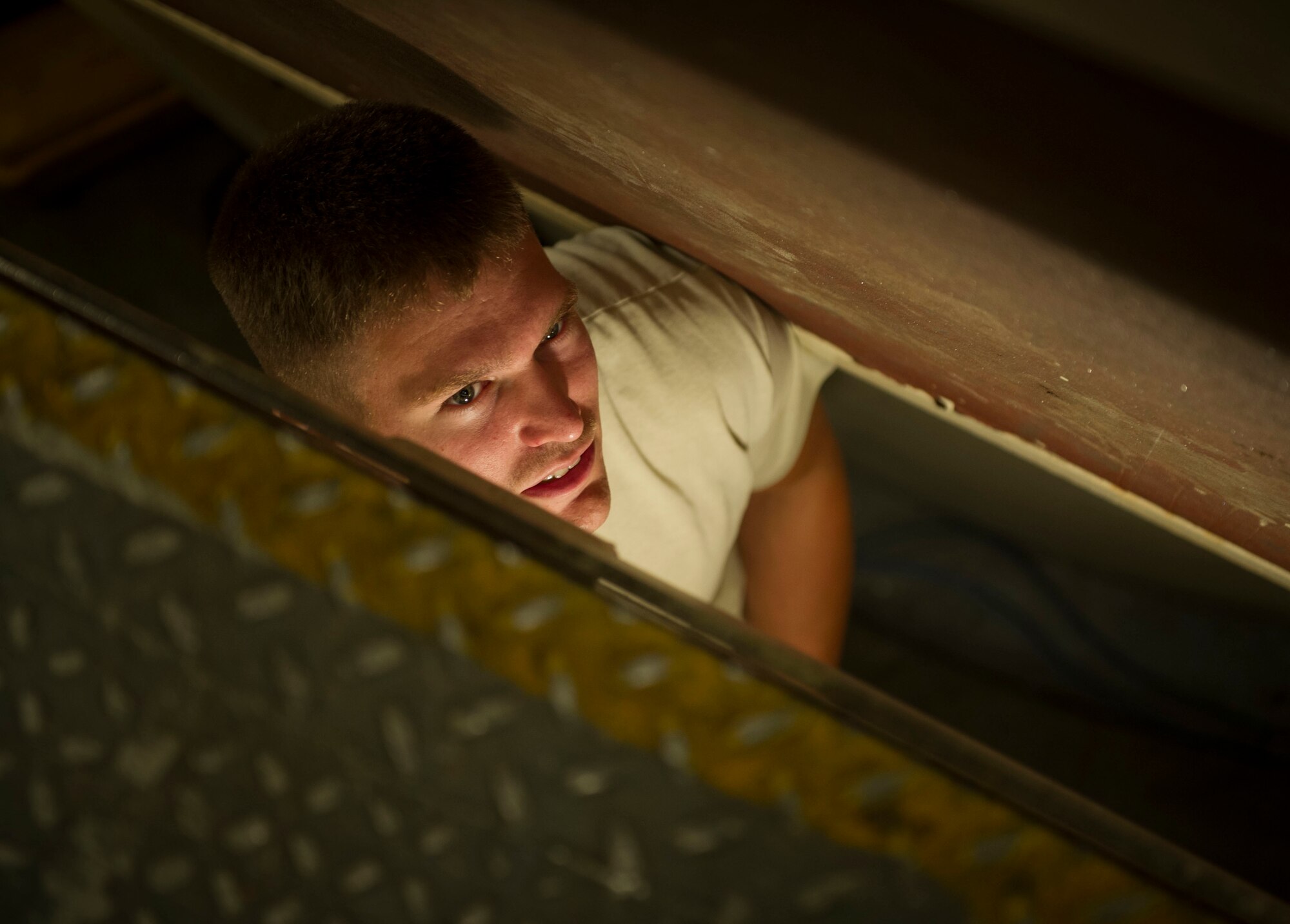 Staff Sgt. Shane Stilson, 91st Missile Maintenance Squadron periodic maintenance team chief, talks with his team member at the A-09 launch facility in the missile complex, N.D., Sept. 7, 2016. PMT members are responsible for the maintenance and upkeep of launch facilities, missile alert facilities and launch control centers. (U.S. Air Force photo/Senior Airman Apryl Hall)