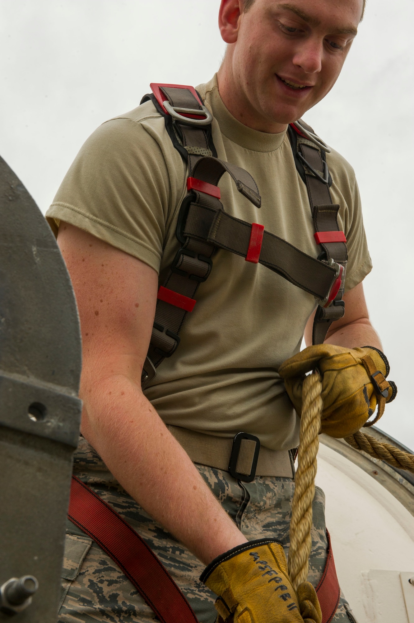 Senior Airman Ian Steck, 91st Missile Maintenance Squadron periodic maintenance team technician, lowers equipment into a launch facility in the missile complex, N.D., Sept. 7, 2016. For safety precaution, equipment is lowered using a rope so Airmen aren’t carrying it while using the ladder to access the launcher equipment room. (U.S. Air Force photo/Senior Airman Apryl Hall)