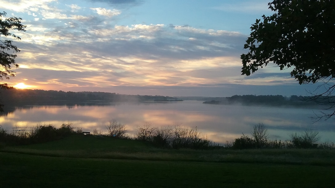 The sun rises on a foggy morning at J. Edward Roush Lake, Huntington, Indiana.