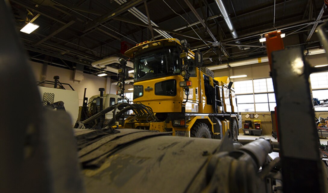 Senior Airman Tyler Karr, 92nd Logistics Readiness Squadron mission generation vehicle and equipment maintenance journeyman, completes summer re-build work on a snow broom Oct. 3, 2016, at Fairchild Air Force Base. Vehicle Maintenance maintains a fleet of more than 400 different vehicles, approximately 36 of them are crucial to winter operations. (U.S. Air Force photo/Senior Airman Mackenzie Richardson)