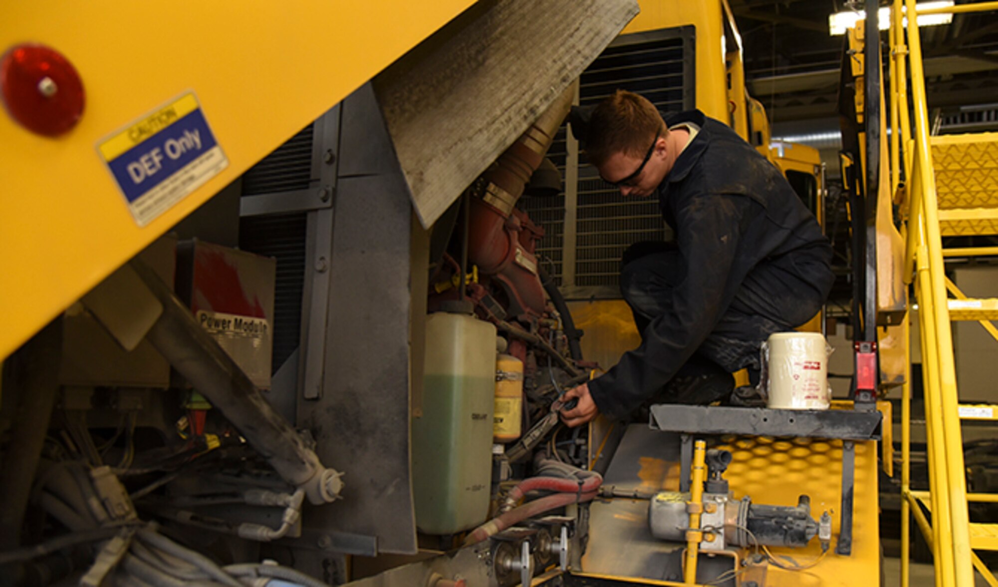 Senior Airman Tyler Karr, 92nd Logistics Readiness Squadron mission generation vehicle and equipment maintenance journeyman, verifies a snow broom is in good working condition Oct. 3, 2016, at Fairchild Air Force Base. Airmen change fluids, filters, safety items such as windshield wipers, conduct in-depth inspections and tire maintenance prior to the first snowfall.  (U.S. Air Force photo/Senior Airman Mackenzie Richardson)