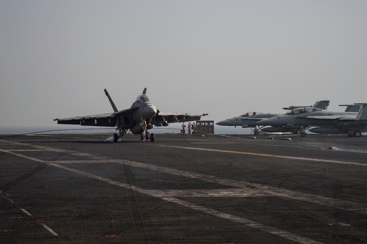 An F/A-18F Super Hornet makes an arrested landing on the flight deck of the aircraft carrier USS Dwight D. Eisenhower in the Persian Gulf, Oct. 4, 2016. The Eisenhower and its Carrier Strike Group are deployed in support of Operation Inherent Resolve in the U.S. 5th Fleet area of operations. Navy photo by Petty Officer 3rd Class Nathan T. Beard

