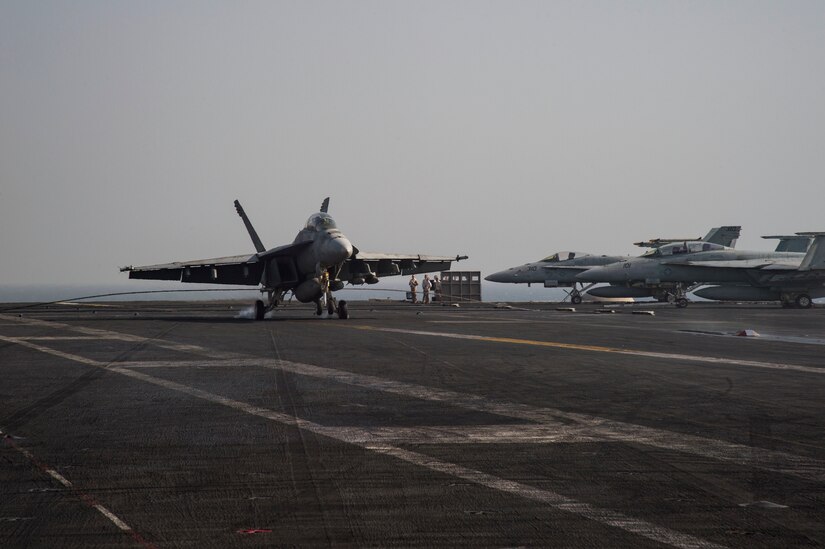 An F/A-18F Super Hornet makes an arrested landing on the flight deck of the aircraft carrier USS Dwight D. Eisenhower in the Persian Gulf, Oct. 4, 2016. The Eisenhower and its Carrier Strike Group are deployed in support of Operation Inherent Resolve in the U.S. 5th Fleet area of operations. Navy photo by Petty Officer 3rd Class Nathan T. Beard

