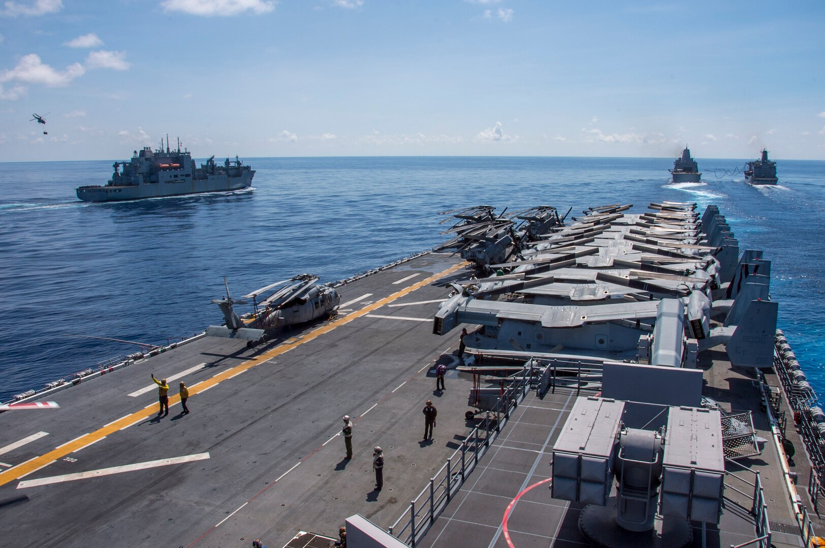 161003-N-TH560-391 Lewis and Clark-class dry cargo ship USNS Washington Chambers (T-AKE 11), left, conducts a vertical replenishment (VERTREP) with amphibious assault ship USS Bonhomme Richard (LHD 6), while amphibious transport dock ship USS Green Bay (LPD 20) conducts a fueling at sea with Military Sealift Command fleet replenishment oiler USNS Walter S. Diehl (T-AO 193), Oct. 3, 2016. Bonhomme Richard, flagship of the Bonhomme Richard Expeditionary Strike Group, is operating in the South China Sea in support of security and stability in the Indo-Asia Pacific region.