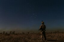 A Marine with Marine Rotational Force – Darwin stands under the Southern Cross star constellation during Exercise Koolendong 16 at Bradshaw Field Training Area, Northern Territory, Australia, Aug. 16, 2016. Koolendong is a trilateral exercise between the Australian Defence Force, U.S. Marine Corps and French Armed Forces New Caledonia. (U.S. Marine Corps photo by Sgt. Sarah Anderson)
