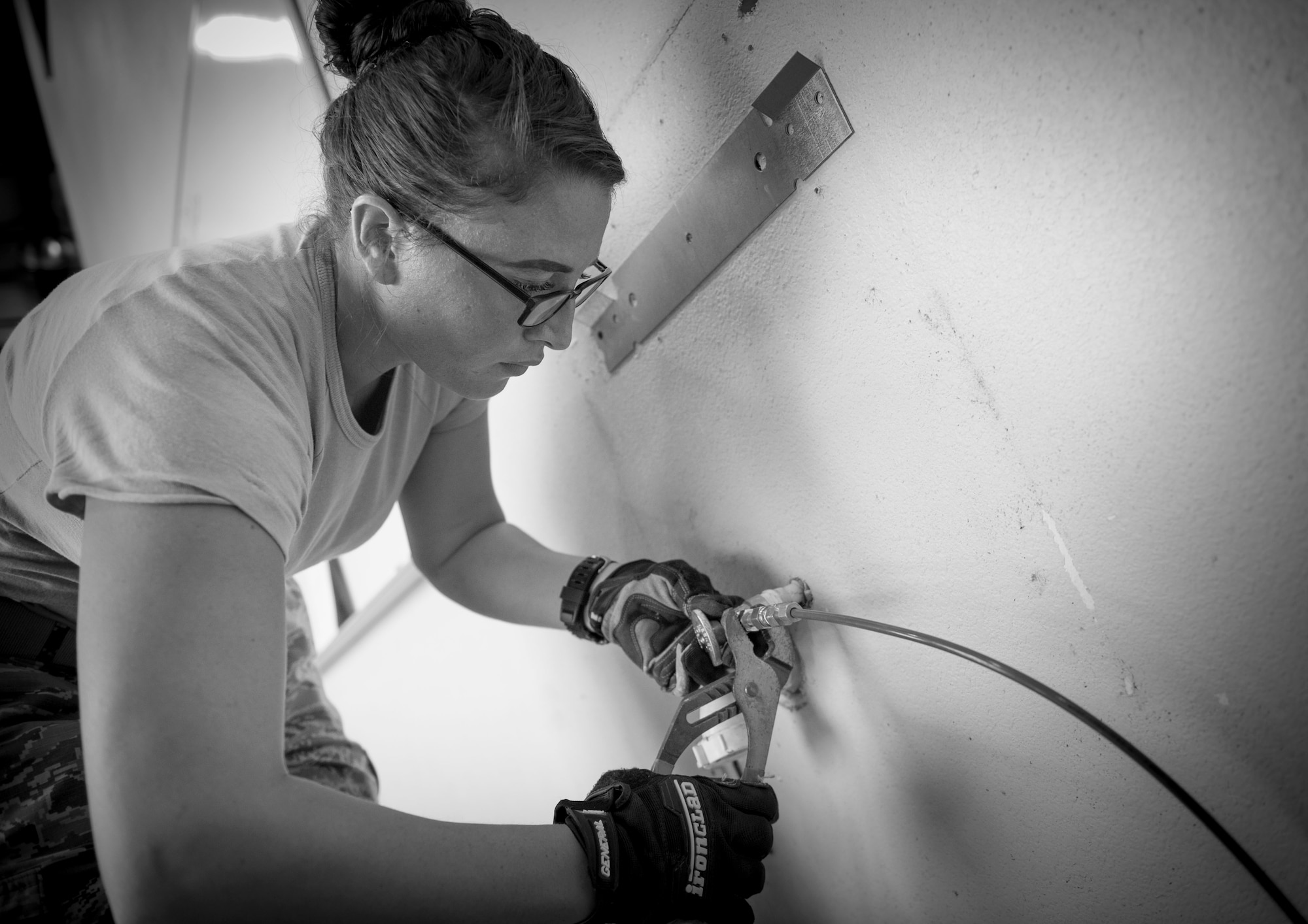 Senior Airman Markita Andrews, a water and fuels systems maintenance journeyman with the 823rd RED HORSE, installs a drinking fountain at the RED HORSE compound on Hurlburt Field, Fla., Oct. 3, 2016. The newly installed fountain will be equipped with a bottle filling station that provides a clean fill with minimal splash. (U.S. Air Force photo by Senior Airman Krystal M. Garrett)
