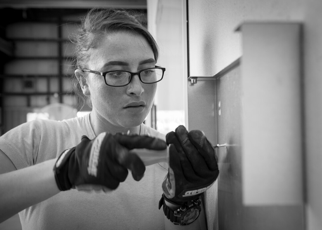 Senior Airman Markita Andrews, a water and fuels systems maintenance journeyman, installs a drinking fountain at the RED HORSE compound on Hurlburt Field, Fla., Oct. 3, 2016. Water and fuels systems maintenance Airmen monitor system operations to ensure compliance with local, state, federal and Department of Defense regulations. (U.S. Air Force photo by Senior Airman Krystal M. Garrett)