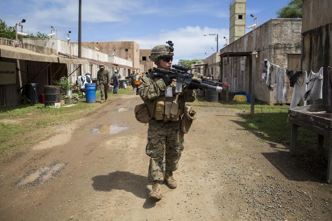 MARINE CORPS TRAINING AREA BELLOWS – Lance Cpl. Justin Rumphrey, a team leader with Charlie Company, 1st Battalion, 3rd Marine Regiment, and a Loganville, Georgia native, patrols through a simulated village during Exercise Island Viper aboard Marine Corps Training Area Bellows, Sept. 29, 2016. Exercise Island Viper is a 3-week-long battalion level training evolution workup that focuses on sharpening the infantry skills of the individual, team and squad. (U.S. Marine Corps Photo by Lance Cpl. Jesus Sepulveda Torres)