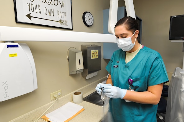 Senior Airman Ceiera Taylor, a dental technician with the 1st Special Operations Dental Squadron, prepares to take x-rays of a patient at Hurlburt Field, Fla., Oct. 4, 2016. Taylor takes x-rays for the dentist as part of an annual check-up for patients. (U.S. Air Force photo by Senior Airman Jeff Parkinson/Released)