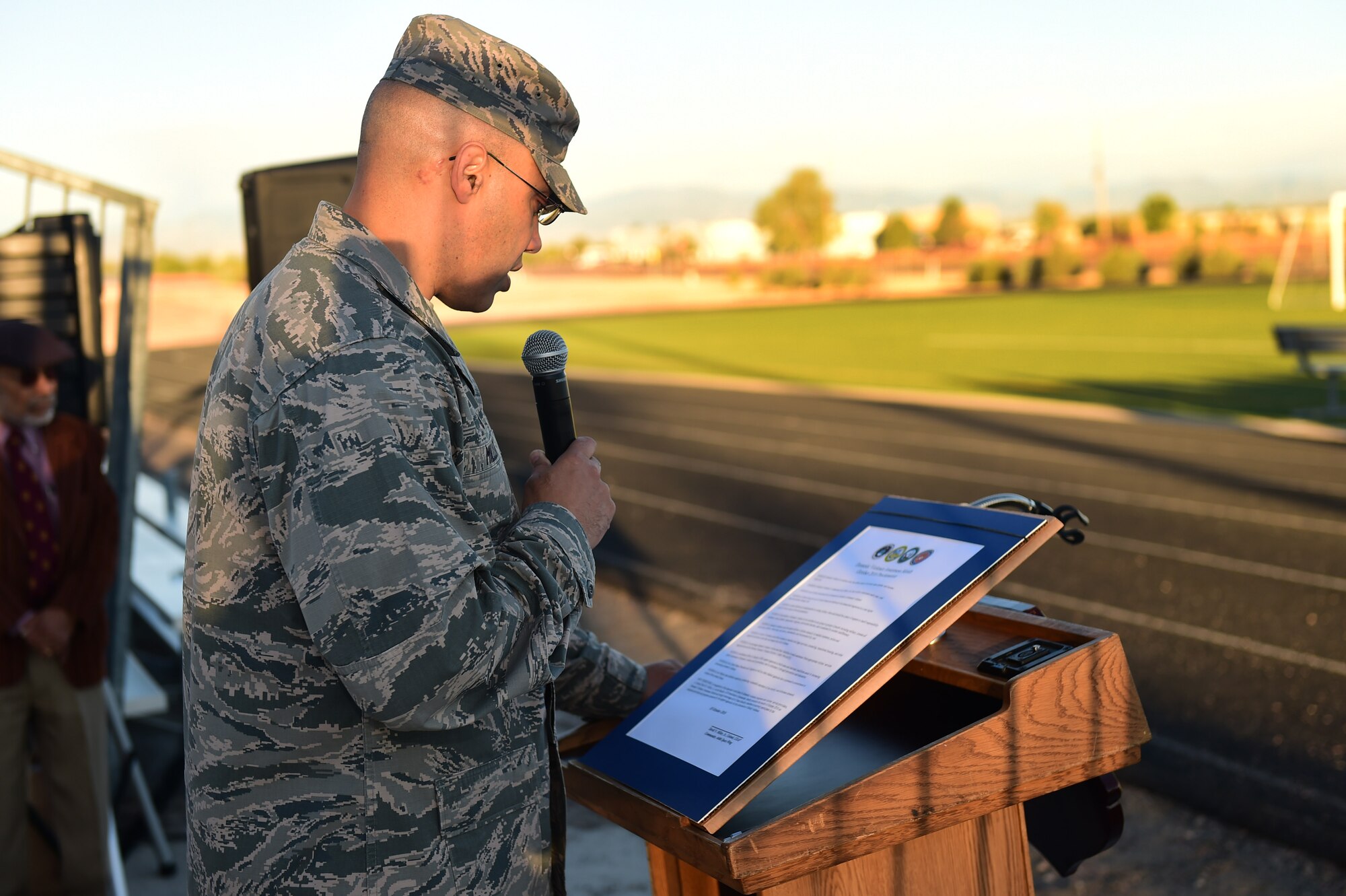 Col. David Miller Jr., 460th Space Wing commander, reads a domestic violence proclamation before a Domestic Violence Awareness Month 5K Run/Walk Oct. 5, 2016, at the outdoor track on Buckley Air Force Base, Colo. The event was held to generate conversation about the issue of domestic violence. (U.S. Air Force photo by Airman 1st Class Gabrielle Spradling/Released)