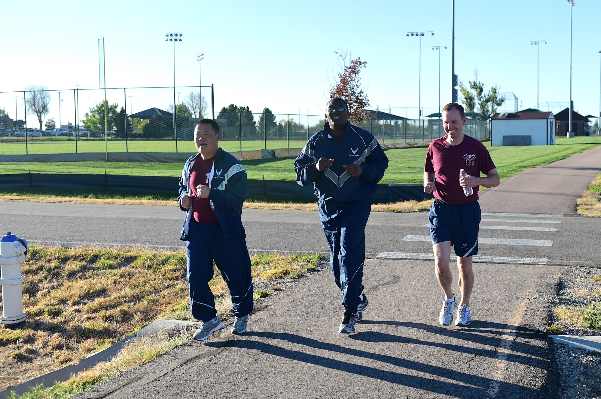 Members of the 460th Medical Group run during a Domestic Violence Awareness Month 5K Run/Walk Oct. 5, 2016, at the outdoor track on Buckley Air Force Base, Colo. The goal of the event was to raise awareness and advertise resources to minimize domestic violence in the United States because, according to National Coalition Against Domestic Violence statistics, nearly 20 people per minute are physically abused by an intimate partner. (U.S. Air Force photo by Airman 1st Class Gabrielle Spradling/Released)