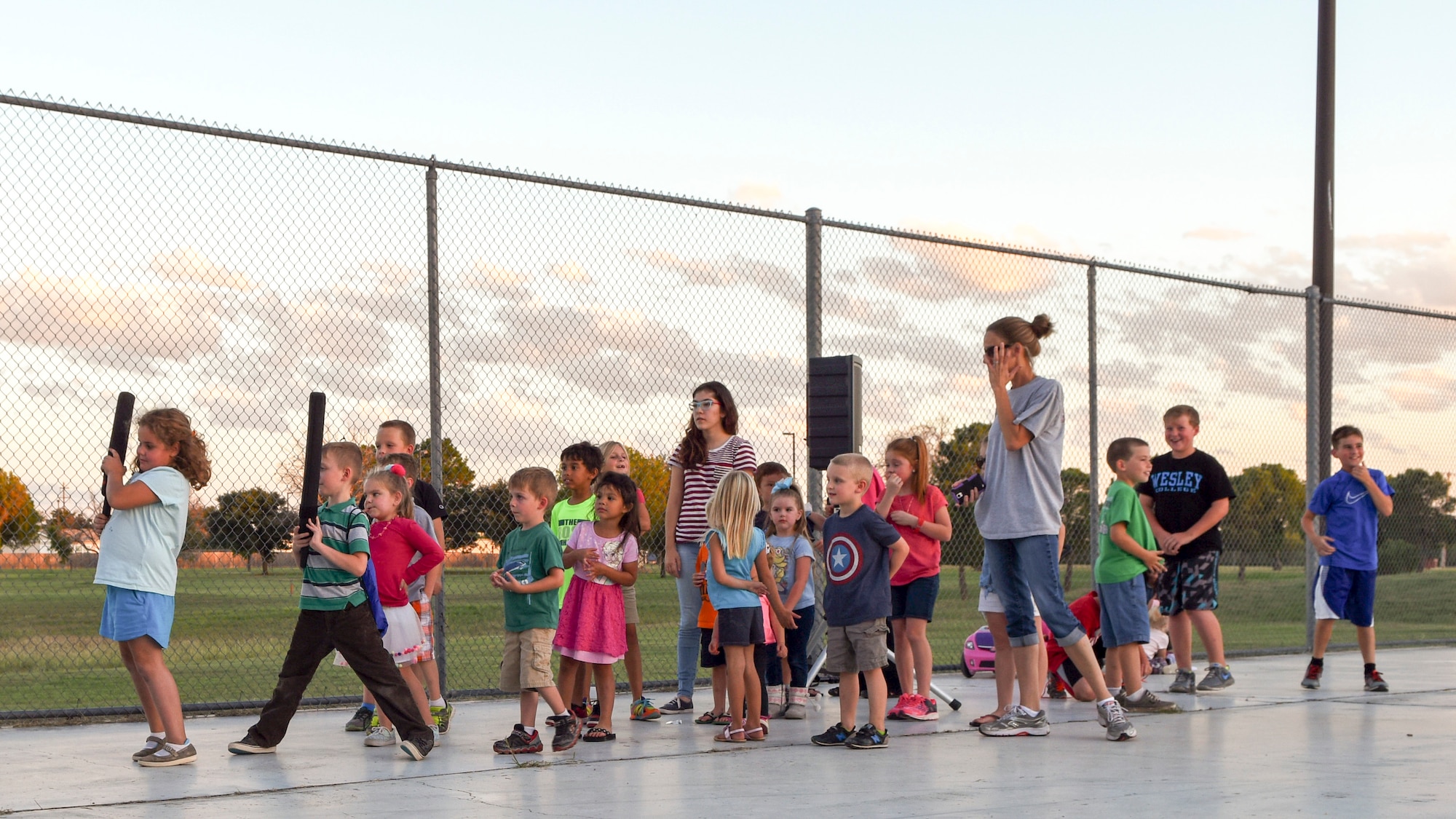 Team Dyess kids line up for less-than-lethal training during National Night Out, at Dyess Air Force Base, Texas, Oct. 4, 2016. Dyess participated in the crime and drug prevention event for the second year along with 12 locations across the Abilene community. (U.S. Air Force photo by Senior Airman Kedesha Pennant)

