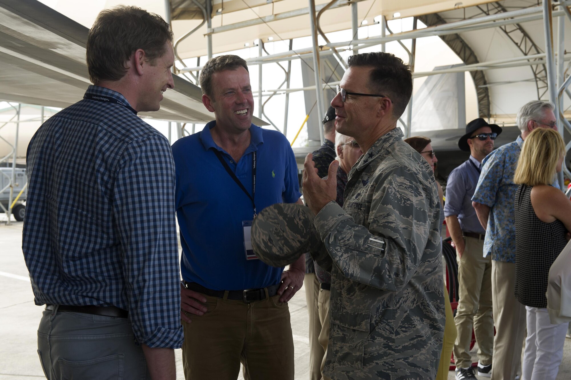 Maj. Gen. Mark Dillon, Pacific Air Forces vice commander, speaks with The Honorable Dan Tehan (center), Australian Minister for Veterans' Affairs, Minister Assisting the Prime Minister for the Centenary of ANZAC, Minister Assisting the Prime Minister for Cyber Security, and Minister for Defence Personnel, during a visit to Joint Base Pearl Harbor-Hickam, Hawaii, by the Australian American Leadership Dialogue (AADL) delegation, Oct. 4, 2016. The AALD brings together U.S. and Australian leaders from government, enterprise, media, education and the community to build upon and improve bilateral relations. This year is the 9th Annual Honolulu Leadership Dialogue co-hosted by U.S. Pacific Command and the East-West Center. (U.S. Air Force photo by Staff Sgt. Alexander Martinez)