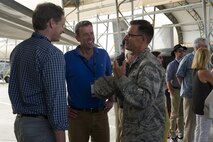 Maj. Gen. Mark Dillon, Pacific Air Forces vice commander, speaks with The Honorable Dan Tehan (center), Australian Minister for Veterans' Affairs, Minister Assisting the Prime Minister for the Centenary of ANZAC, Minister Assisting the Prime Minister for Cyber Security, and Minister for Defence Personnel, during a visit to Joint Base Pearl Harbor-Hickam, Hawaii, by the Australian American Leadership Dialogue (AADL) delegation, Oct. 4, 2016. The AALD brings together U.S. and Australian leaders from government, enterprise, media, education and the community to build upon and improve bilateral relations. This year is the 9th Annual Honolulu Leadership Dialogue co-hosted by U.S. Pacific Command and the East-West Center. (U.S. Air Force photo by Staff Sgt. Alexander Martinez)