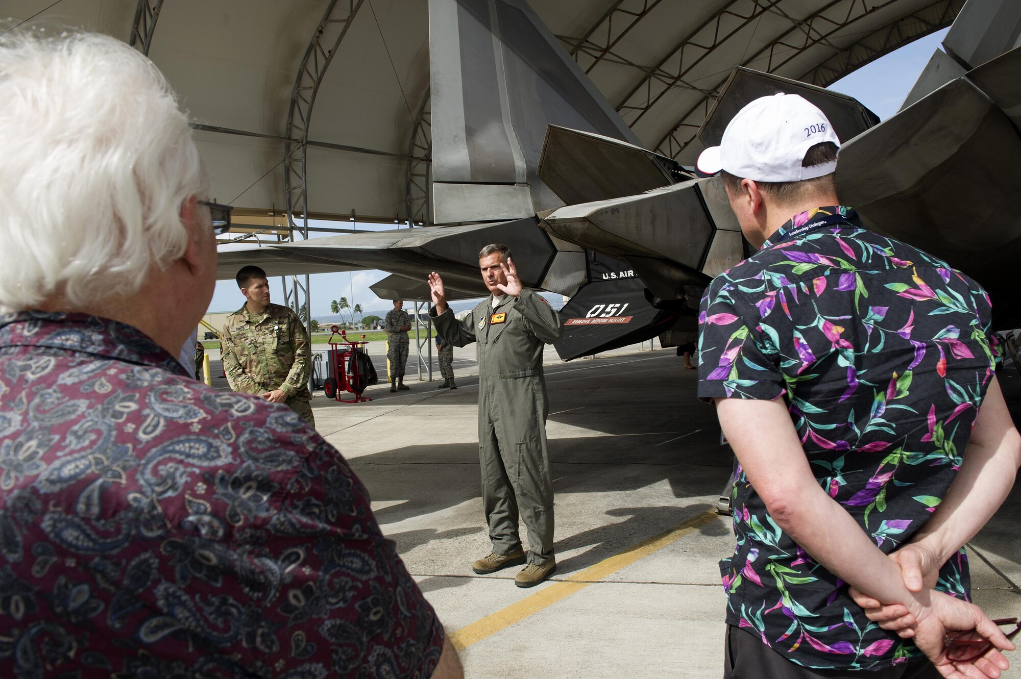 U.S. Air Force Col. John York, Hawaii Air National Guard 154th Oprations Group commander, discusses the capabilities of the F-22 Raptor to delegates of the Australian American Leadership Dialogue (AALD) during their visit to Joint Base Pearl Harbor-Hickam, Hawaii, Oct. 4, 2016. The AALD brings together U.S. and Australian leaders from government, enterprise, media, education and the community to build upon and improve bilateral relations. This year is the 9th Annual Honolulu Leadership Dialogue co-hosted by U.S. Pacific Command and the East-West Center. (U.S. Air Force photo by Staff Sgt. Alexander Martinez)