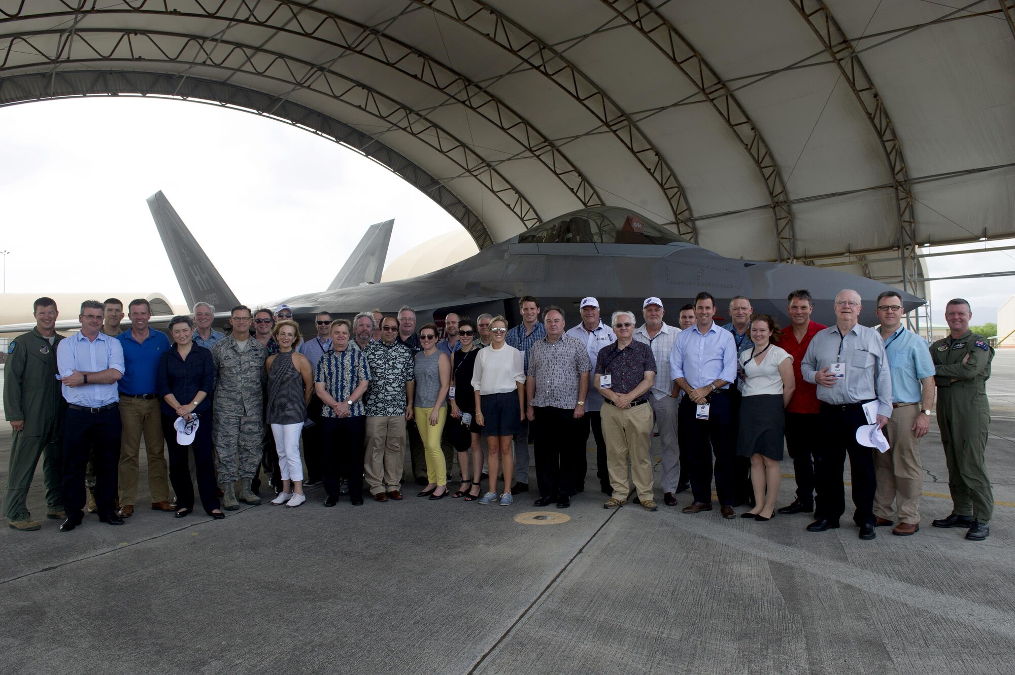 Delegates of the Australian American Leadership Dialogue (AALD) and Pacific Air Forces members pose for a photo in front of an F-22 Raptor during the delegation's visit to Joint Base Pearl Harbor-Hickam, Hawaii, Oct. 4, 2016. The AALD brings together U.S. and Australian leaders from government, enterprise, media, education and the community to build upon and improve bilateral relations. This year is the 9th Annual Honolulu Leadership Dialogue co-hosted by U.S. Pacific Command and the East-West Center. (U.S. Air Force photo by Staff Sgt. Alexander Martinez)