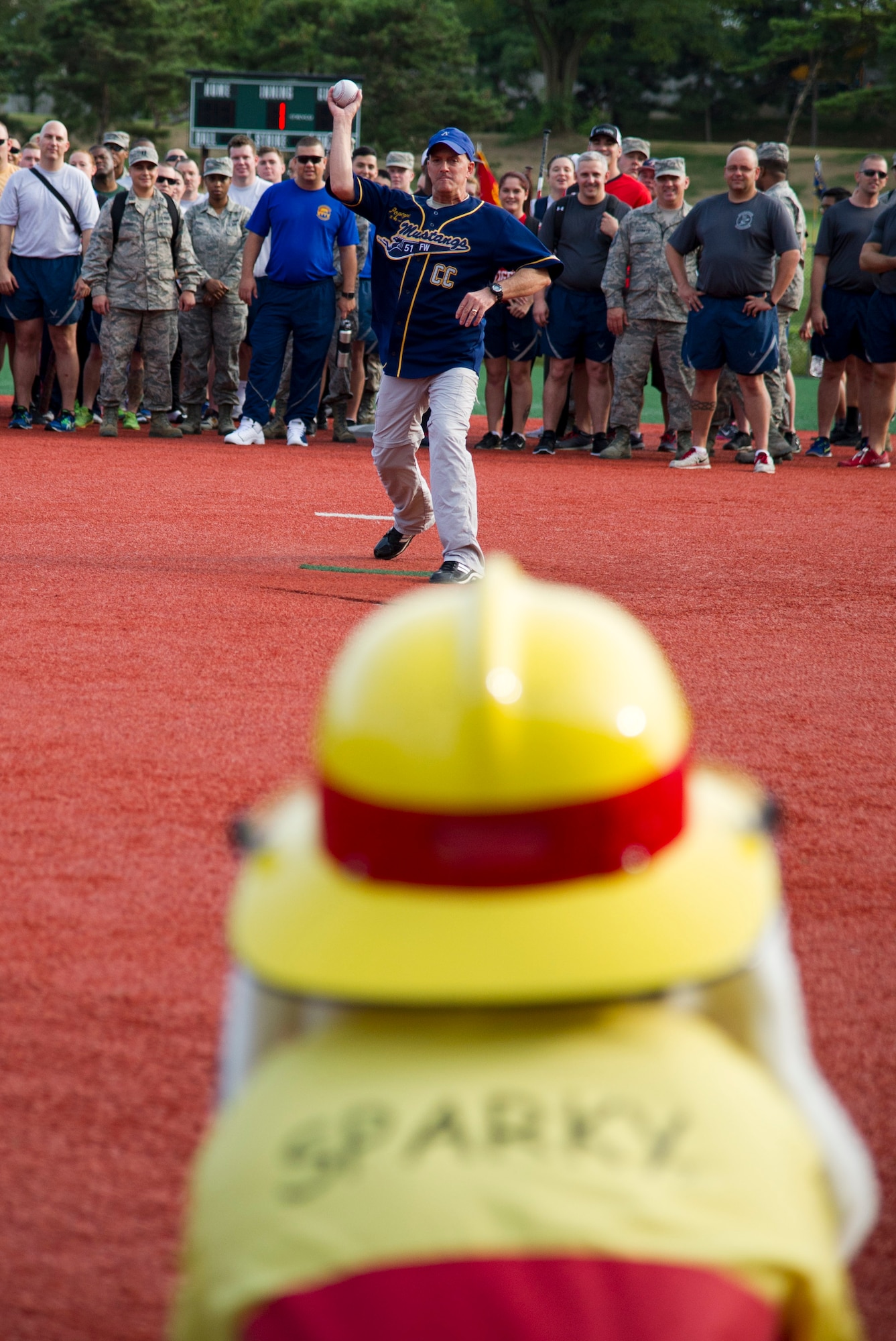 U.S. Air Force Col. Andrew Hansen, 51st Fighter Wing commander, throws the opening pitch to kick off Osan Cup 2016 at Osan Air Base, Republic of Korea, Sept. 29, 2016. Osan Cup is a two-day sporting event to build teamwork, resiliency, camaraderie and family. (U.S. Air Force photo by Staff Sgt. Jonathan Steffen)