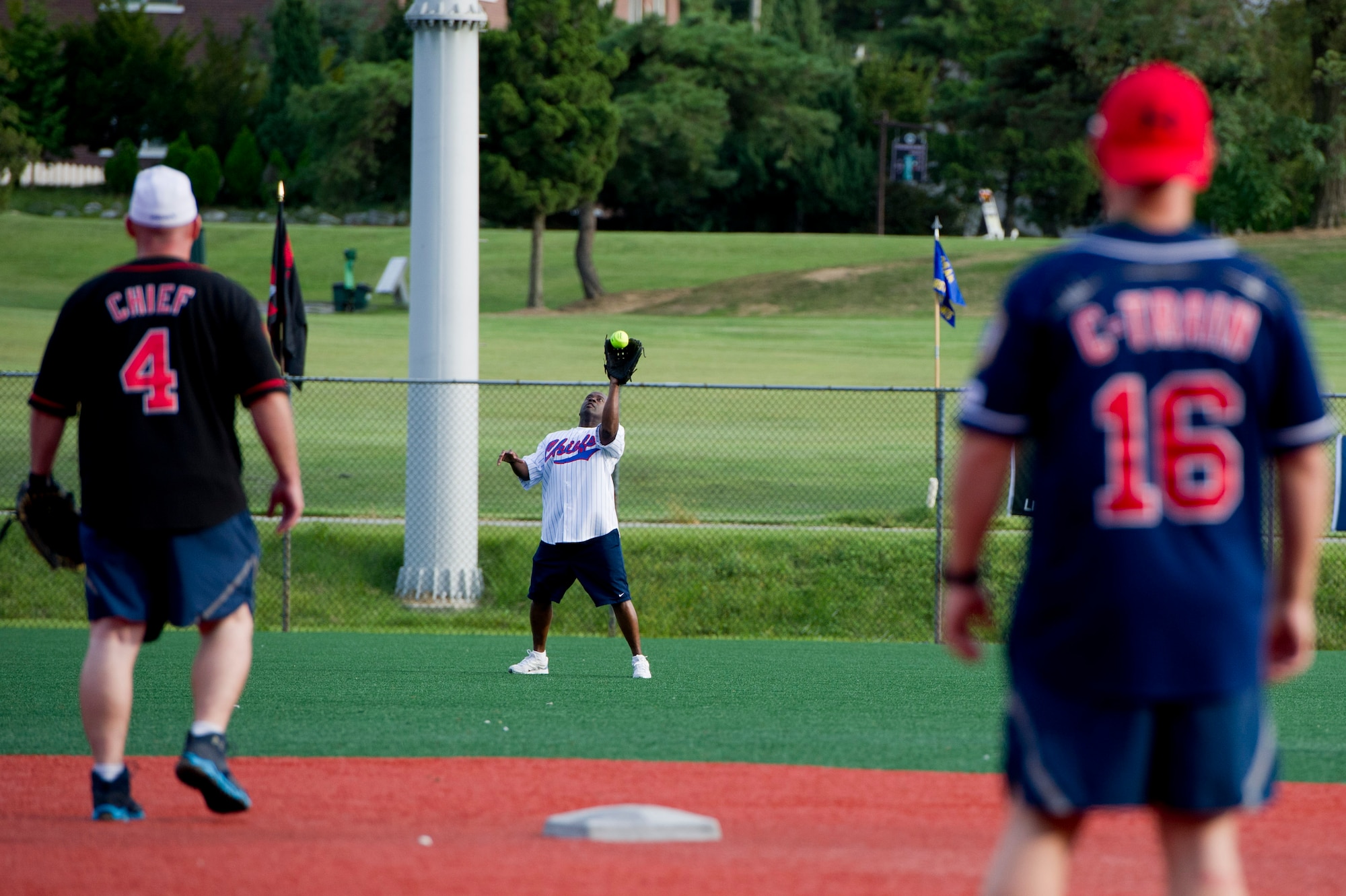 U.S. Air Force Chief Master Sgt. Thaddeus Brannon, 51st Medical Group superintendent, catches a fly ball during the Eagles vs. Chiefs softball game at Osan Air Base, Republic of Korea, Sept. 29, 2016. The Chiefs beat the Eagles 7-1 at the end of the three-inning game. (U.S. Air Force photo by Staff Sgt. Jonathan Steffen)