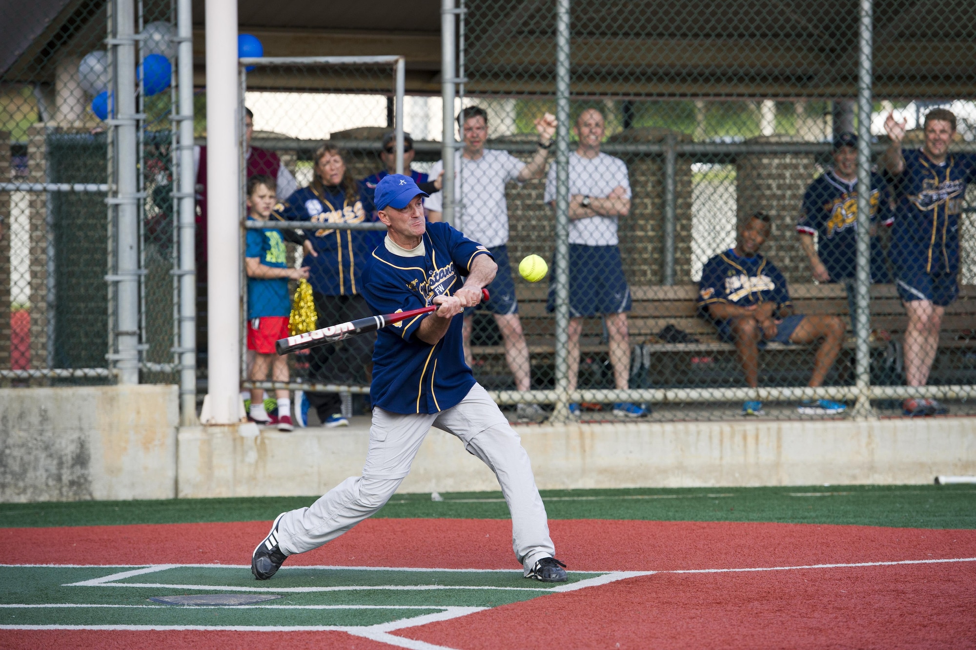 U.S. Air Force Col. Andrew Hansen, 51st Fighter Wing commander, swings for a hit during the Eagles vs. Chiefs softball game at Osan Air Base, Republic of Korea, Sept. 29, 2016. The Eagles vs. Chiefs game was one of many events during Osan Cup 2016, including basketball, volleyball and bowling. (U.S. Air Force photo by Staff Sgt. Jonathan Steffen) 