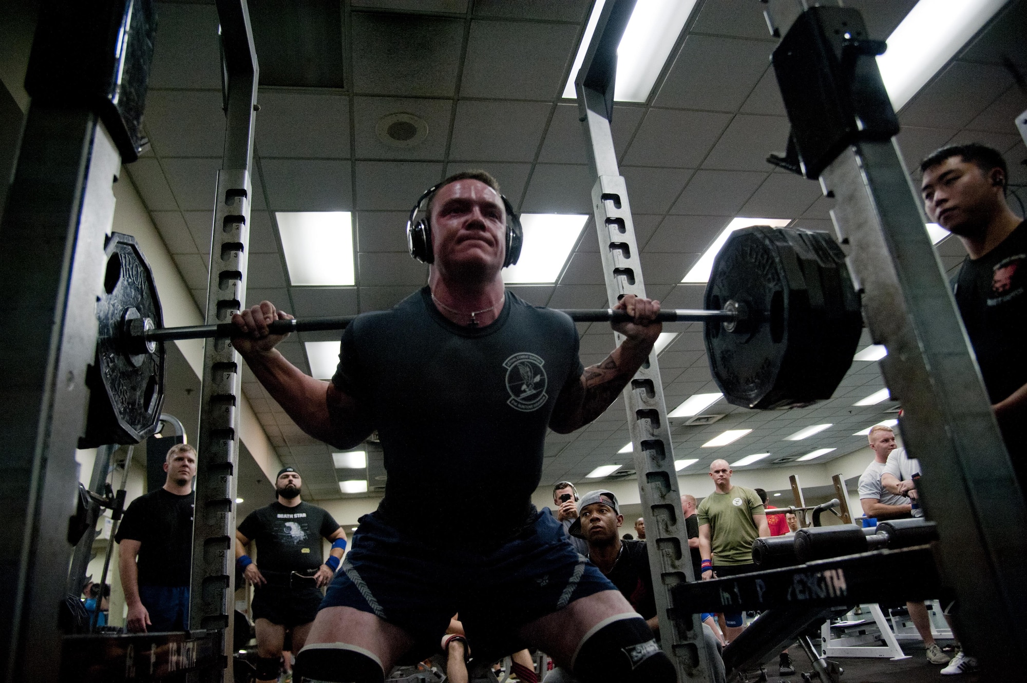 U.S. Air Force Senior Airman Benjamin Weishaar, 51st Munitions Squadron conventions crew chief, performs a 495-pound back squat during Osan Cup 2016 at Osan Air Base, Republic of Korea, Sept. 29, 2016. Osan Cup allowed units to work and compete together in a variety of sporting events. (U.S. Air Force photo by Staff Sgt. Jonathan Steffen) 