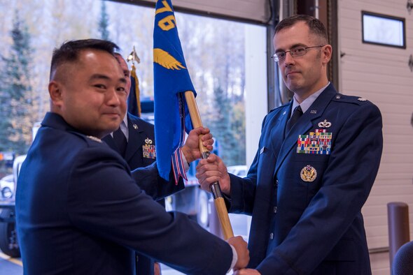 JOINT BASE ELMENDORF-RICHARDSON, Alaska -- Lt. Col. Kass Larson officially takes command of the 176th Wing's 176th Civil Engineer in a ceremony here Sep. 24, 2016. Lt. Col. Kass Larson came to the wing from the National Guard Bureau, bringing with him years of high-dollar project management and leadership experience. (U.S. Air National Guard photo by Tech. Sgt. Alicia N. Halla/ Released)