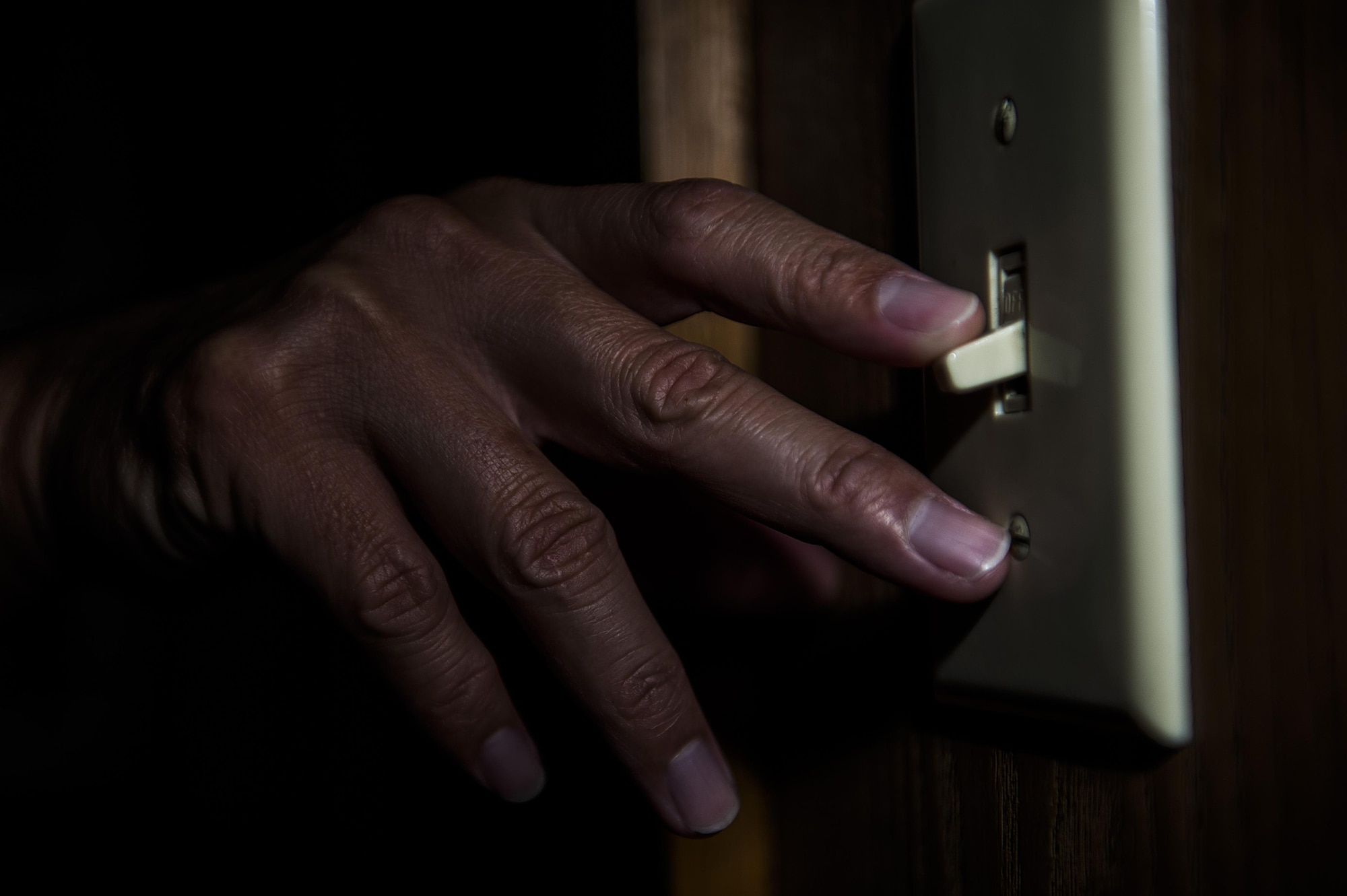 This photo illustration of a light switch being turned off is a small step to saving energy as part of the Kadena Air Base energy awareness efforts. In 2012, President Barack Obama issued a presidential proclamation declaring October as National Energy Action Month. In the proclamation, Obama called upon Americans to work together “to achieve greater energy security, a more robust economy, and a healthier environment for our children.” (U.S. Air Force Photo Illustration by Senior Airman Stephen G. Eigel)