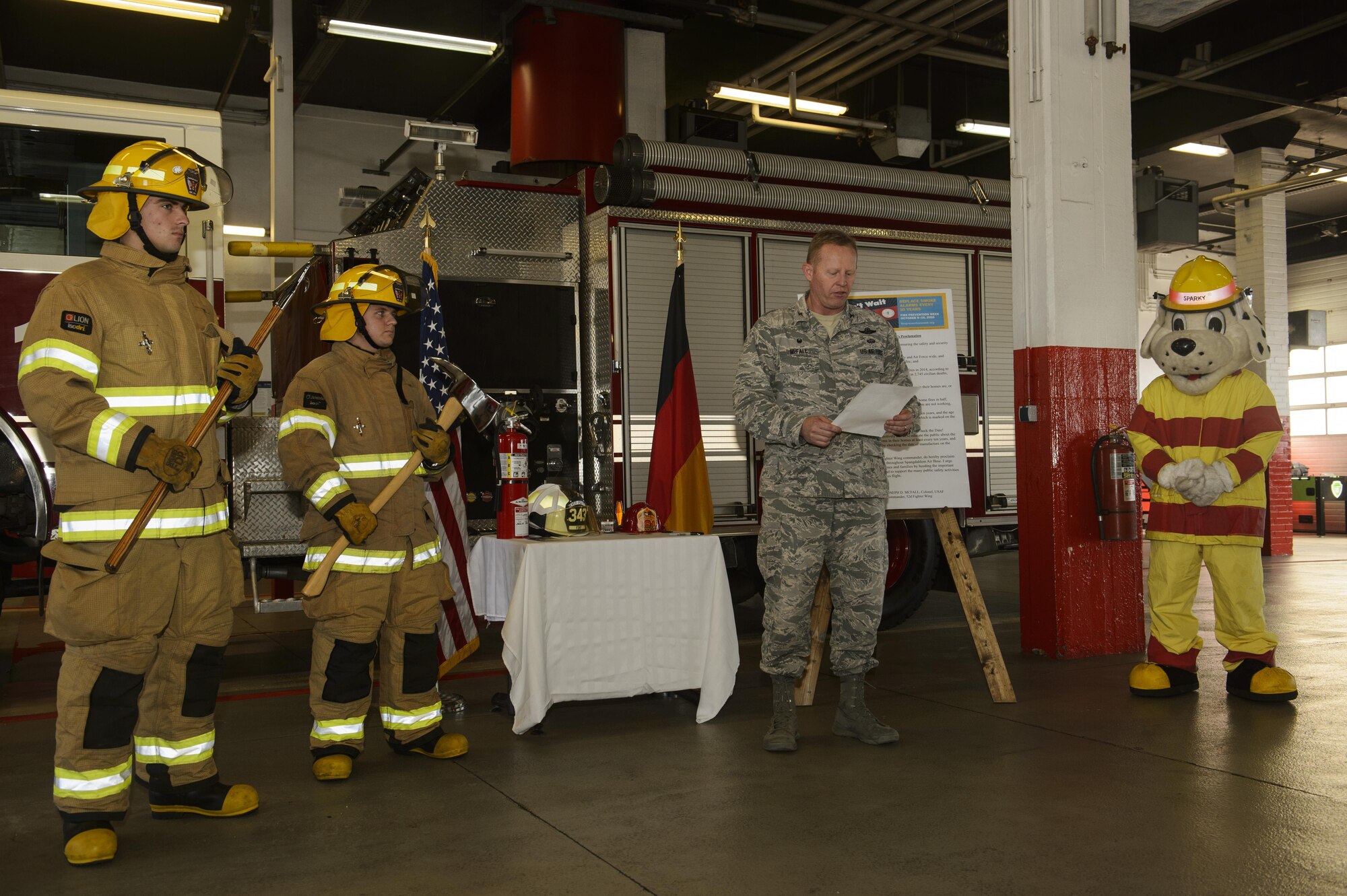 U.S. Air Force Col. Joseph McFall, 52nd Fighter Wing commander, reads the 2016 Fire Prevention Week proclamation at the base fire department on Spangdahlem Air Base, Germany, Oct. 5, 2016. This years Fire Prevention Week will be observed Oct. 9-15 with the theme "Don't wait - Check the Date." The emphasis is on replacing batteries yearly in all smoke alarms and replacing the alarms themselves every 10 years. (U.S. Air Force photo by Staff Sgt. Jonathan Snyder)