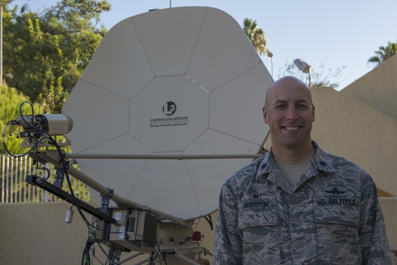 U.S. Air Force Lt. Col. Timothy Meerstein, 39th Communications Squadron (CS) commander, poses for a photo in front of a communication satellite dish Sept. 30, 2016, at Incirlik Air Base, Turkey. The 39th CS provides communications needs across the installation. (U.S. Air Force photo by Senior Airman John Nieves Camacho)