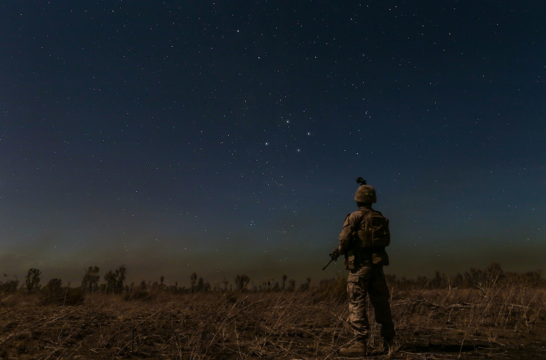 A Marine with Marine Rotational Force – Darwin stands under the Southern Cross star constellation during Exercise Koolendong 16 at Bradshaw Field Training Area, Northern Territory, Australia, Aug. 16, 2016. Koolendong is a trilateral exercise between the Australian Defence Force, U.S. Marine Corps and French Armed Forces New Caledonia.