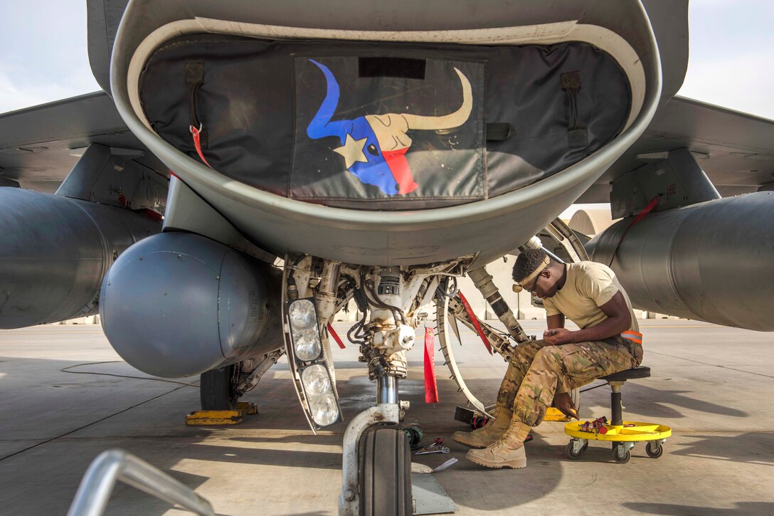 Air Force Airman 1st Class Keion Newman prepares to replace a heat exchanger on an F-16C Fighting Falcon aircraft at Bagram Airfield, Afghanistan, Oct. 5, 2016. Newman is an electrical and environmental systems specialist assigned to the 455th Expeditionary Aircraft Maintenance Squadron. Air Force photo by Senior Airman Justyn M. Freeman