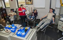 Team Minot members donate blood during the Battle of the Badges blood drive at Minot Air Force Base, N.D., Sept. 30, 2016. Along with the possibility of saving peoples’ lives, donors also received free food and a tee-shirt. (U.S. Air Force photo/Airman 1st Class Christian Sullivan)