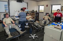 Team Minot members donate blood during the Battle of the Badges blood drive at Minot Air Force Base, N.D., Sept. 30, 2016. The Battle of the Badges was created for a friendly, competitive way for people on base to donate blood. (U.S. Air Force photo/Airman 1st Class Christian Sullivan)