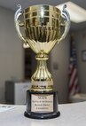 The Battle of the Badges blood drive trophy sits on a table at Minot Air Force Base, N.D., Sept. 30, 2016. During the blood drive, members earned points toward a final score to win bragging rights and a trophy until next year’s drive. (U.S. Air Force photo/Airman 1st Class Christian Sullivan)