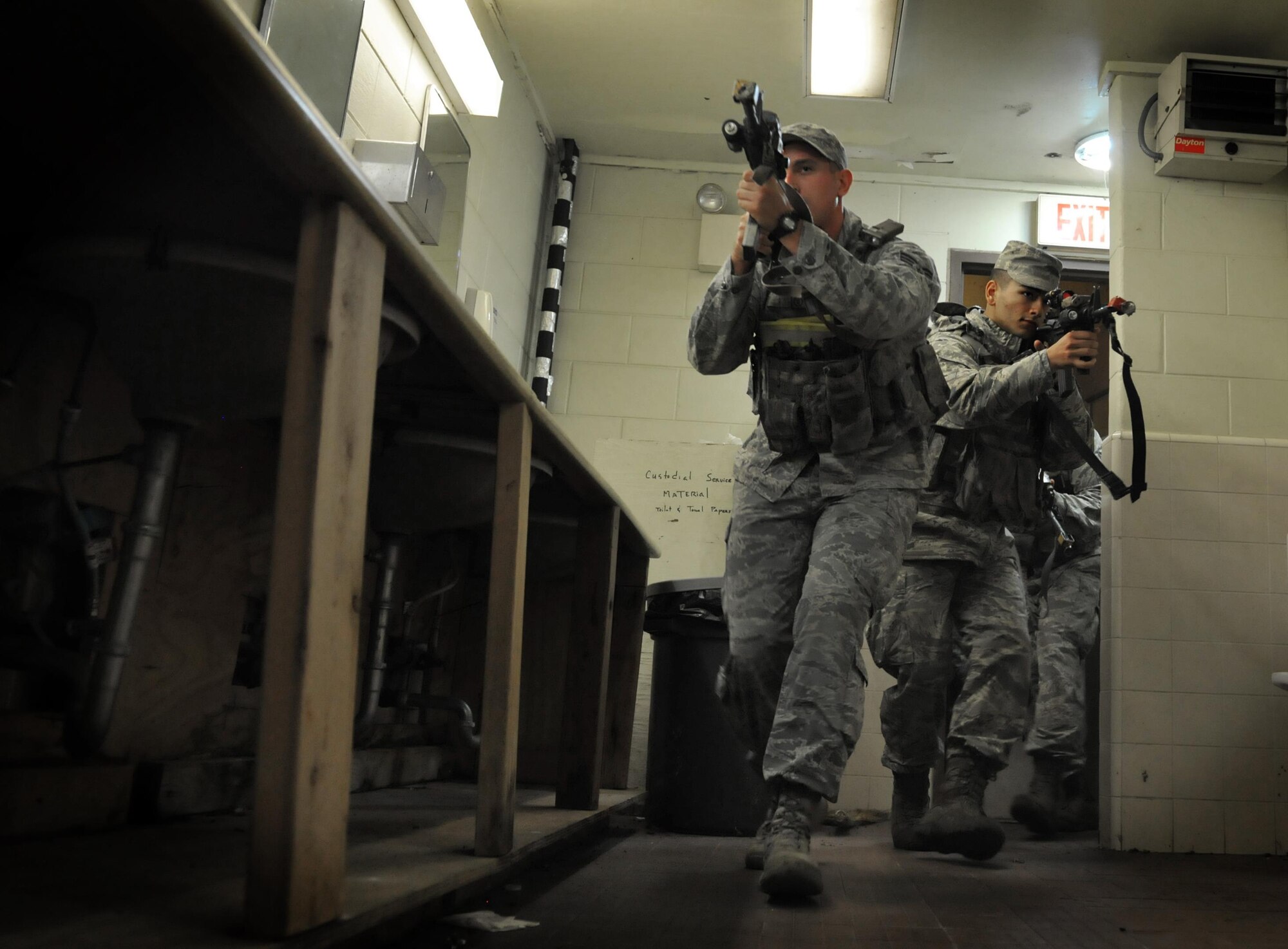 U.S. Air Force 8th Security Forces Squadron, Alpha Sector mid-shift members, perform room-clearing procedures during exercise Beverly Pack 17-1 at Kunsan Air Base, Republic of Korea, Oct. 6, 2016. The U.S. Air Force and Republic of Korea Air Force provide combat capabilities and training by performing exercises throughout the year to enhance communication and interoperability between military forces so they are prepared to fight as a combined force. (U.S. Air Force photo by Senior Airman Colville McFee/Released) 