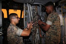 Sgt. Jesse Castillo instructs Lance Cpl. Tremain Lacy on the wiring of a CH-53 helicopter at Center for Naval Aviation Technical Training on Marine Corps Air Station New River, Oct. 3. CNATT trains Marines and Sailors in operational maintenance and repair of aeronautical equipment at the air station. Castillo is an instructor at CNATT and Lacy is a student at CNATT. (U.S. Marine Corps photo by Pfc. Juan Madrigal/Released)