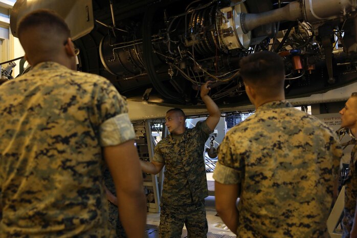 Sgt. David J. Dailey instructs students on how the CH-53 helicopter is assembled at the Center for Naval Aviation Technical Training on Marine Corps Air Station New River, Oct. 3. CNATT trains Marines and Sailors in operational maintenance and repair of aeronautical equipment at the air station. Dailey is an instructor at CNATT. (U.S. Marine Corps photo by Pfc. Juan Madrigal/Released)