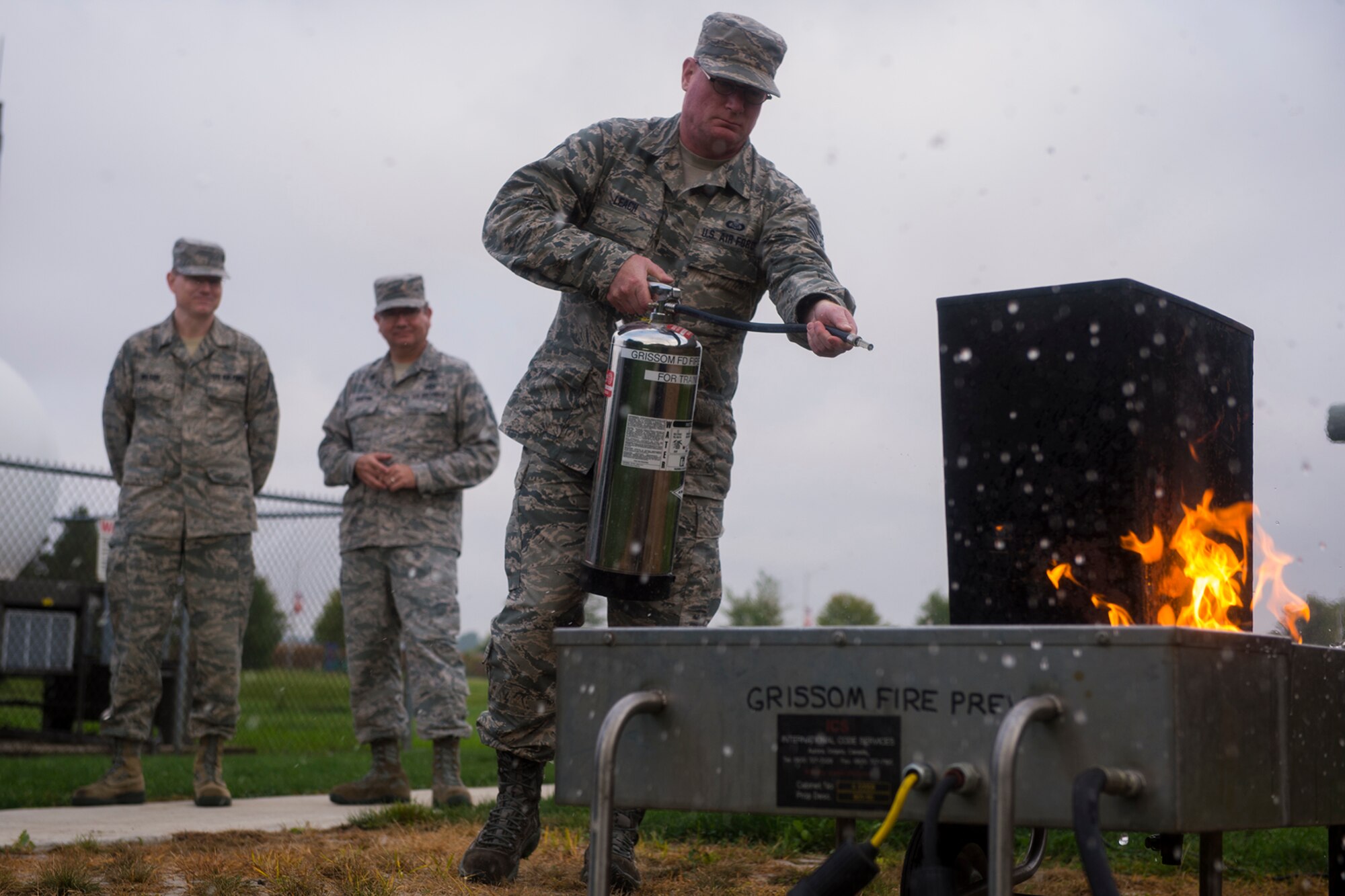 Tech. Sgt. Steven Leach, 434th Air Refueling Wing noncommissioned officer in charge of reports, uses a fire extinguisher to put out a fire during a hands-on fire extinguisher training October 2, 2016 at Grissom Air Reserve Base, Ind. The fire was created using a propane powered fire trainer operated by a member of the Grissom Fire Department. (U.S. Air Force photo/Staff Sgt. Dakota Bergl) 