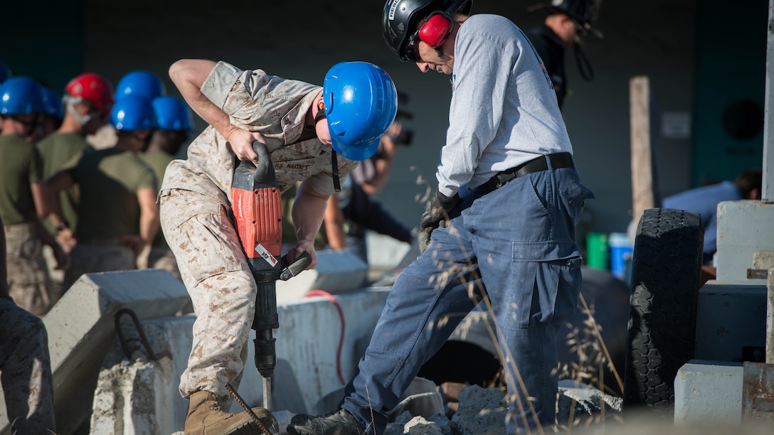 Marines from I Marine Expeditionary Force joined firefighters from the San Francisco area to learn about urban search and rescue techniques Oct. 5, 2016 at building 600 on Treasure Island. The service members learned how to cut through concrete and metal bars, reinforce structures, and move 3-5,000 pounds of concrete with wooden sticks.