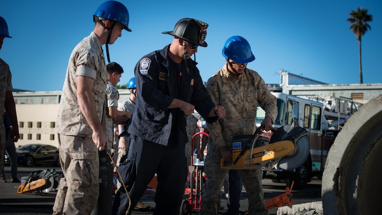 Marines from I Marine Expeditionary Force joined firefighters from the San Francisco area to learn about urban search and rescue techniques Oct. 5, 2016 at building 600 on Treasure Island. The service members learned how to cut through concrete and metal bars, reinforce structures, and move 3-5,000 pounds of concrete with wooden sticks.