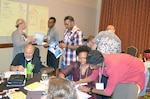 Couples participating in the Strong Bond’s training event work together during a team building exercise at the Strong Bonds Marriage Enrichment Training event at the Horseshoe Bay Resort in Marble Falls, Texas, Sept. 17-19. The event was conducted by the U.S. Army North Command Chaplain’s office.