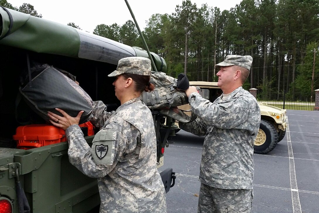 Soldiers with the South Carolina National Guard load their military vehicle to assist with Hurricane Matthew response at the McCrady Training Center, Eastover, S.C., Oct. 5, 2016. Army National Guard photo by 1st Lt. Jess Donnelly