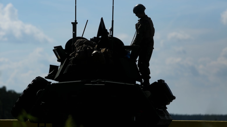 Marines with various Light Armored Reconnaissance Battalions ready their weapons and vehicles for the first-ever Bushmaster Challenge at range SR-7 at Marine Corps Base Camp Lejeune, North Carolina, Oct. 3, 2016. The Bushmaster table is fabricated to replicate the enemy using a hole-down position with hidden vehicles, combining elements taken from what has been seen during the times of OIF/OEF, as well as adding motorcycles and friendly buildings or vehicles that the Marines must be consciously aware of during live-fire events.