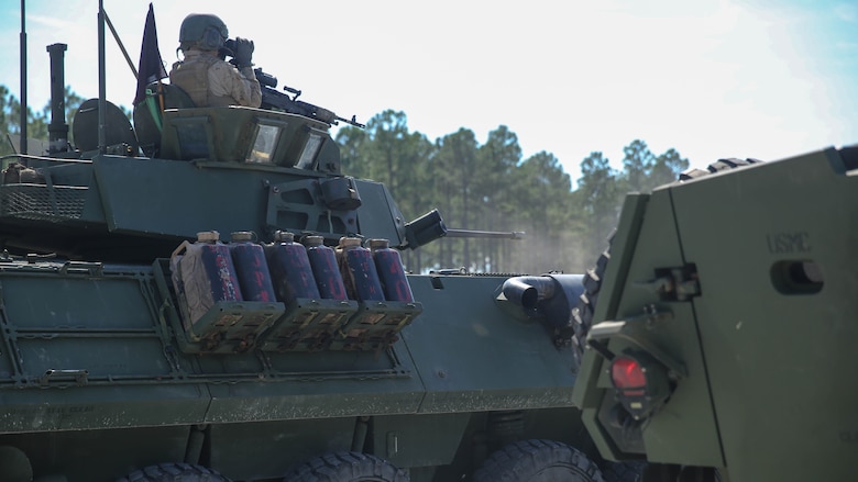 Light-armored vehicles, or LAV-25’s, stand in front of the firing line before Marines with various Light Armored Reconnaissance Battalions battle sight zero their weapons for the first-ever Bushmaster Challenge at range SR-7 at Marine Corps Base Camp Lejeune, North Carolina, Oct. 3, 2016. LAR battalions perform combined arms reconnaissance and security missions in support of the ground combat element. Their mission is to conduct reconnaissance, execute security and economy of force operations, and within their capabilities, limited offensive or defensive operations that exploit the units’ mobility and firepower. 