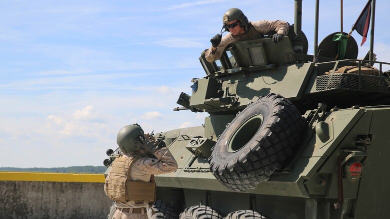 Marines with various Light Armored Reconnaissance Battalions ready their weapons and vehicles for the first-ever Bushmaster Challenge at range SR-7 at Marine Corps Base Camp Lejeune, North Carolina, Oct. 3, 2016. The Bushmaster table is fabricated to replicate the enemy using a hole-down position with hidden vehicles, combining elements taken from what has been seen during the times of OIF/OEF, as well as adding motorcycles and friendly buildings or vehicles that the Marines must be consciously aware of during live-fire events. 