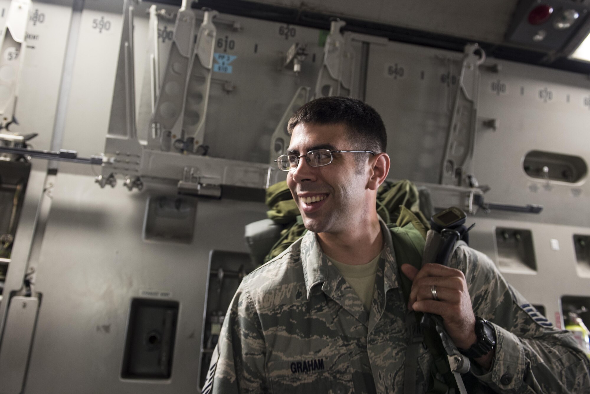 Master Sgt. Daniel Graham, 621st Contingency Response Squadron air traffic controller, boards a C-17 Globemaster III at Joint Base McGuire-Dix-Lakehurst, N.J., Oct. 6, 2016. Graham is one of more than 30 Airmen, consisting of command and control, airfield assessment, aerial port, aircraft maintenance, contracting, and security forces, from the 621st Contingency Response Wing deploying to Port Au Prince International Airport, Haiti, in response to Hurricane Matthew.