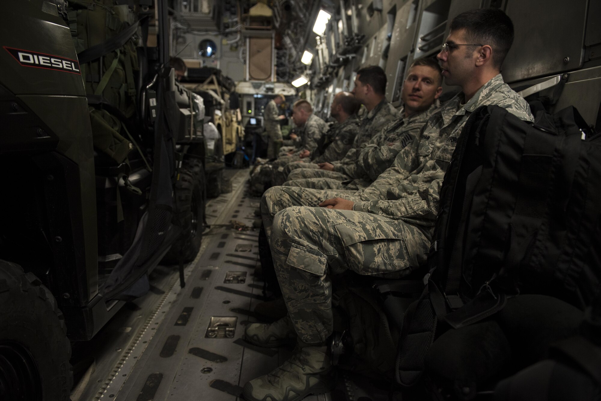 Airmen of the 621st Contingency Response Wing wait for equipment to be leaded onto before taking off in a C-17 Globemaster III at Joint Base McGuire-Dix-Lakehurst, N.J. on their way to Port-au-Prince, Haiti in response to Hurricane Matthew, October 6, 2016. The CRW is highly-specialized in rapidly deploying personnel to quickly open airfields and establish, expand, sustain, and coordinate air mobility operations alongside joint and intra-agency partners. 