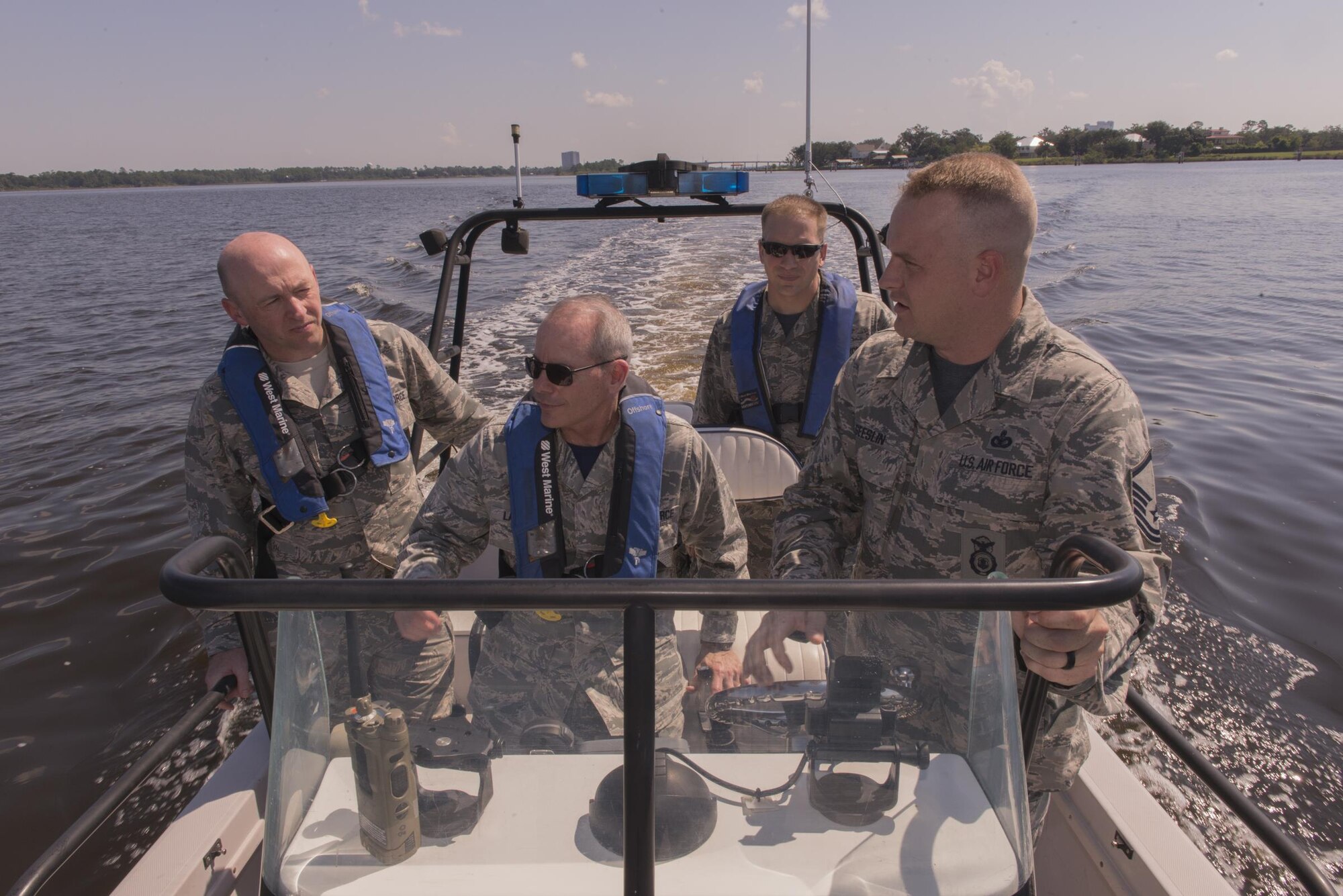 Maj. Gen. Robert LaBrutta, 2nd Air Force commander, receives a coastal water security briefing from Master Sgt. Brandon Geeslin, 81st Security Forces Squadron anti-terrorism officer, in the back bay during an immersion tour Sept. 22, 2016, on Keesler Air Force Base, Miss. The tour allowed LaBrutta to become familiar with the 81st Training Wing mission, operations and personnel. (U.S. Air Force photo by Andre Askew/Released)