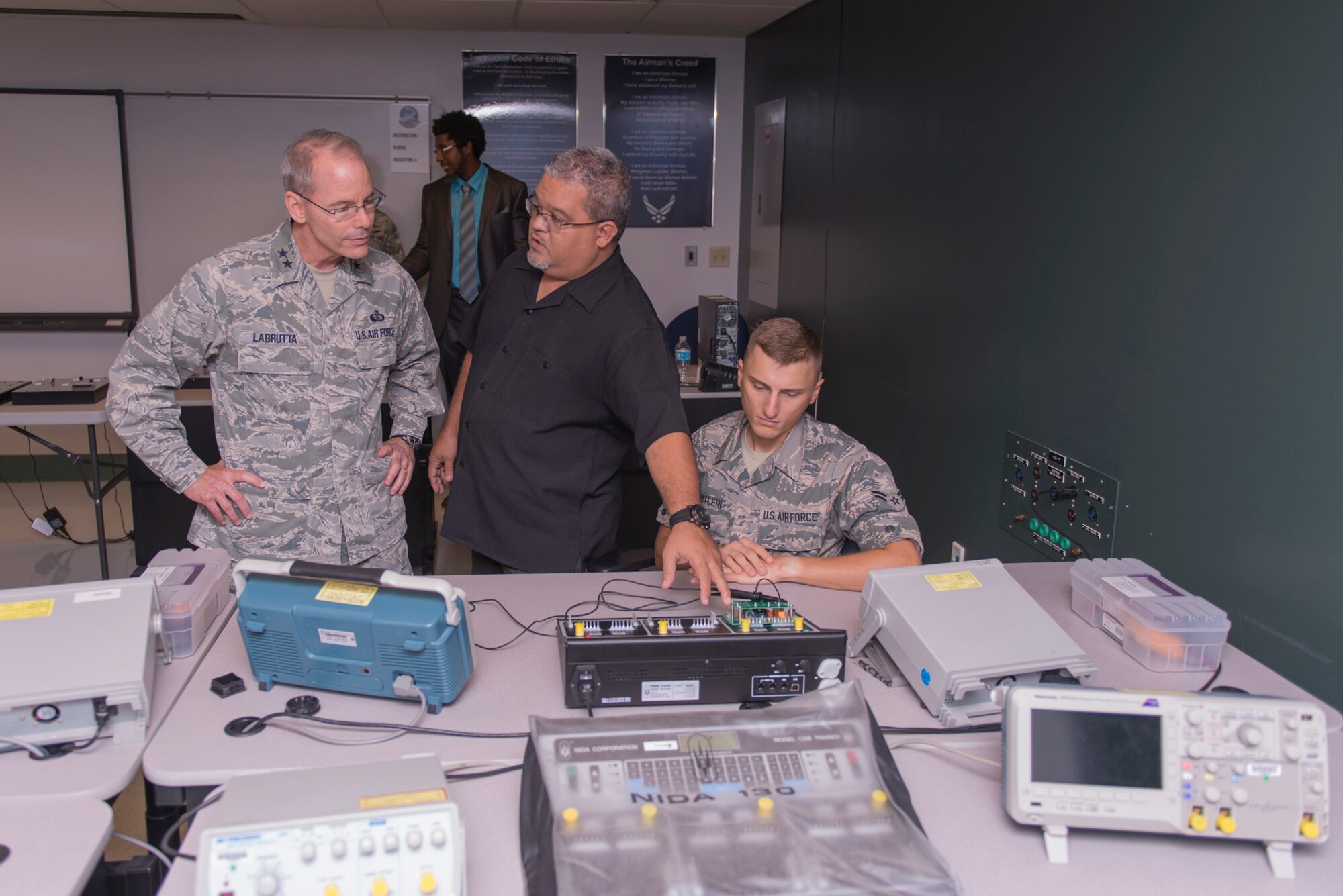 Maj. Gen. Robert LaBrutta, 2nd Air Force commander, receives a cyber support common course briefing from Juan Cobar, 333rd Training Squadron instructor, at Dolan Hall during an immersion tour Sept. 22, 2016, on Keesler Air Force Base, Miss. The tour allowed LaBrutta to become familiar with the 81st Training Wing’s mission, operations and personnel. (U.S. Air Force photo by Andre Askew/Released)