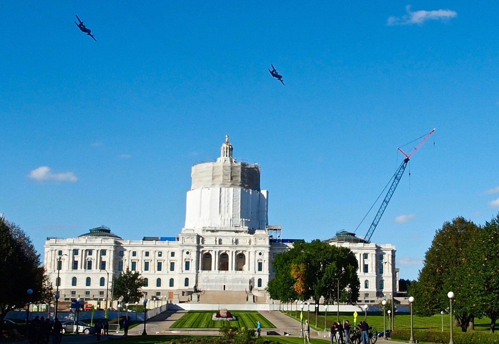 Two C-130s from the 934th Airlift Wing perform a flyover at the Minnesota Medal of Honor Memorial groundbreaking ceremony Oct. 3.