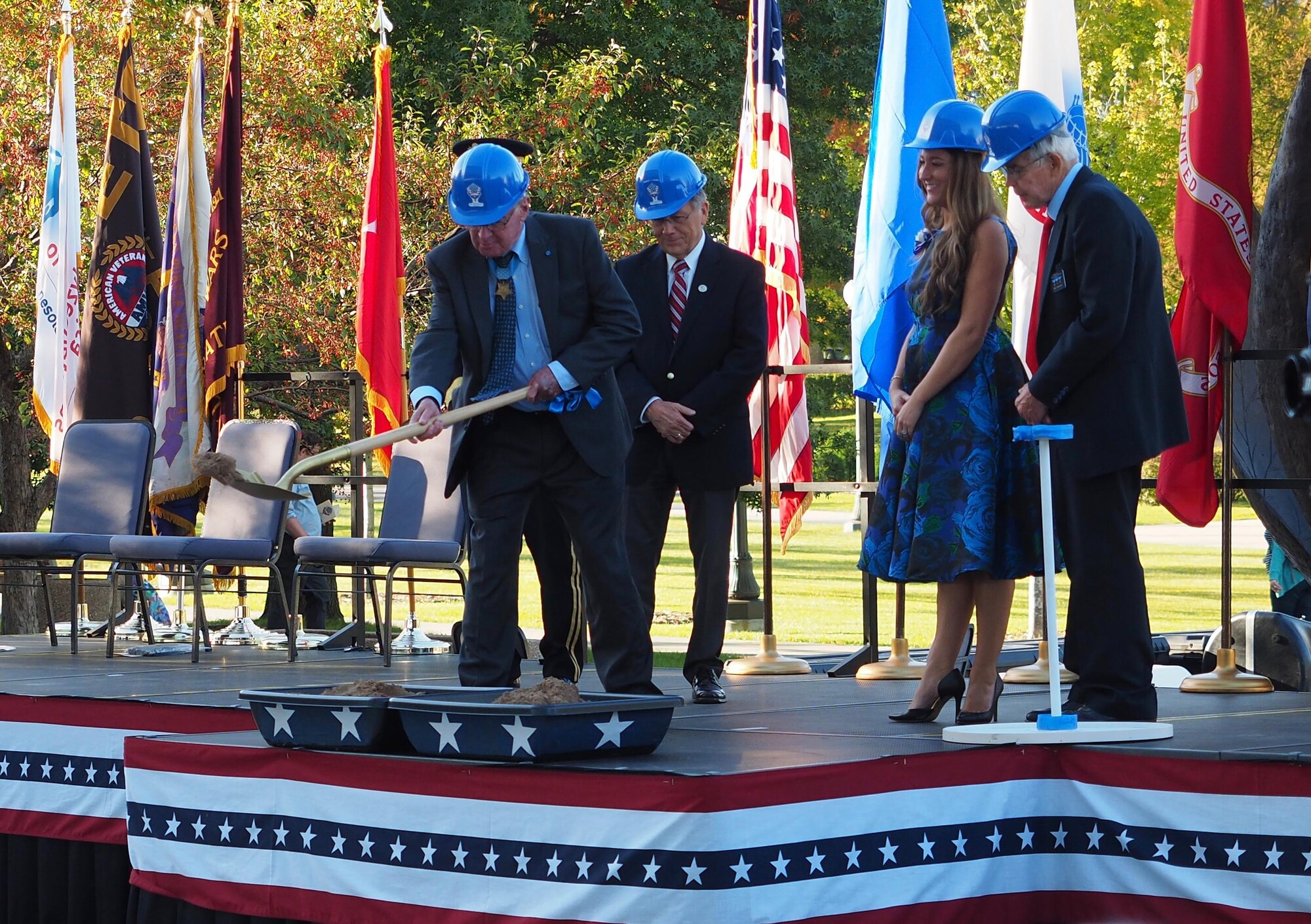 Medal of Honor recipient Thomas Kelley lifts a ceremonial shovel at the Minnesota Medal of Honor Memorial groundbreaking ceremony Oct. 3.